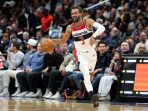 1000459316 Aksi Trae Young saat mengatur serangan Washington Wizards